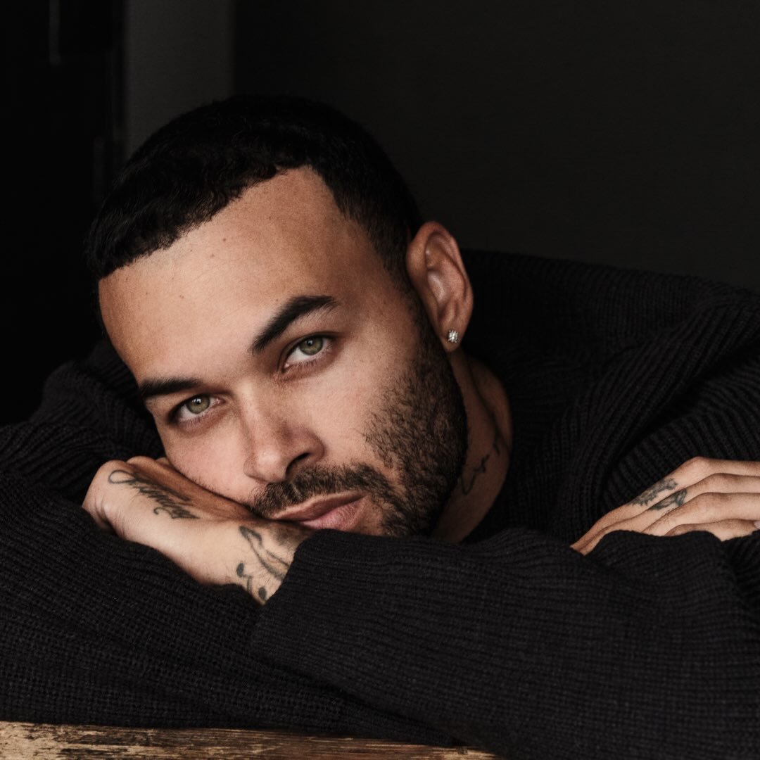 Don Benjamin holding his book My Truth